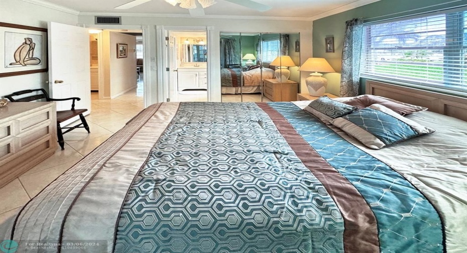Primary Bathroom is Ensuite in Bedroom. Mirrored Closet Doors in Primary Bedroom