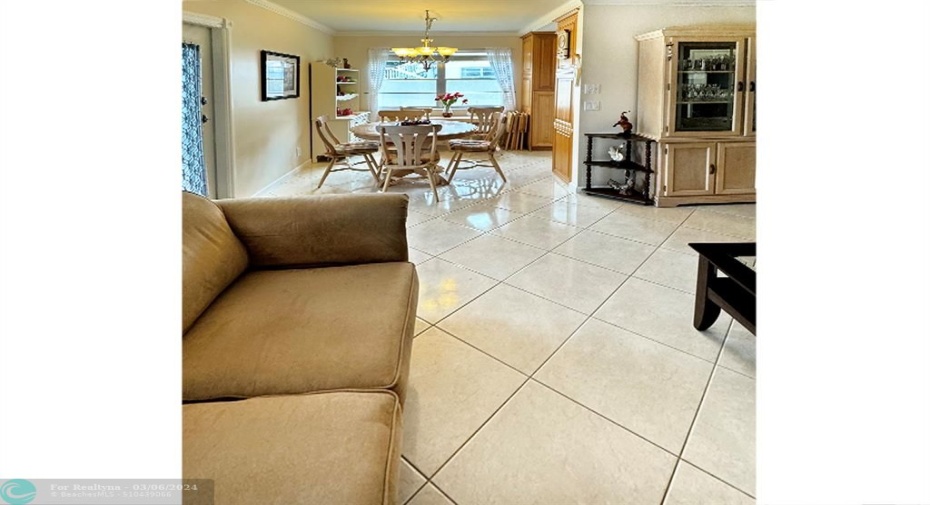 Dining Area is Adjacent to Bright Kitchen
