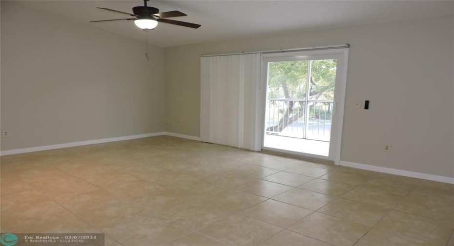 LIVING / DINING ROOM- HURRICANE SLIDING GLASS DOOR TO SCREENED BALCONY