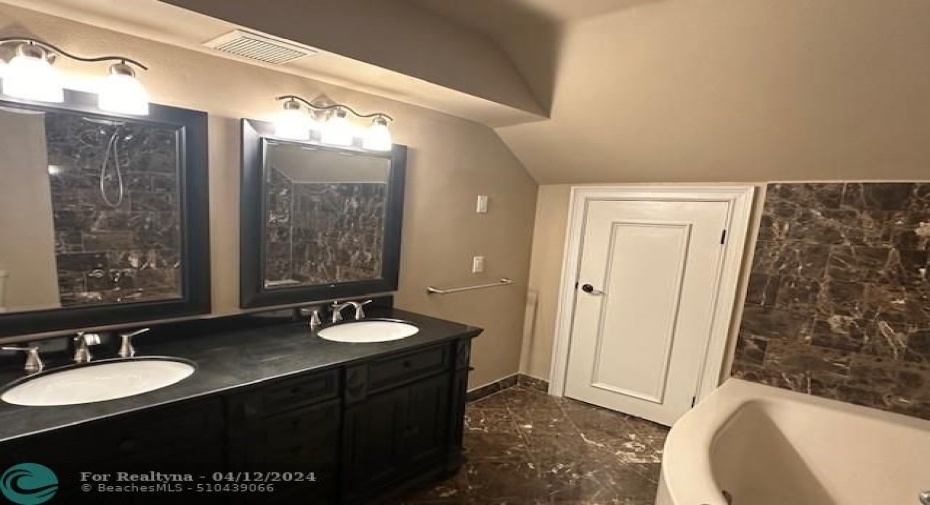 Dual sinks. Marble floors