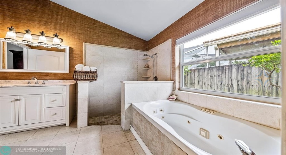 Master Bath with large vanity, separate shower and Jacuzzi style tub