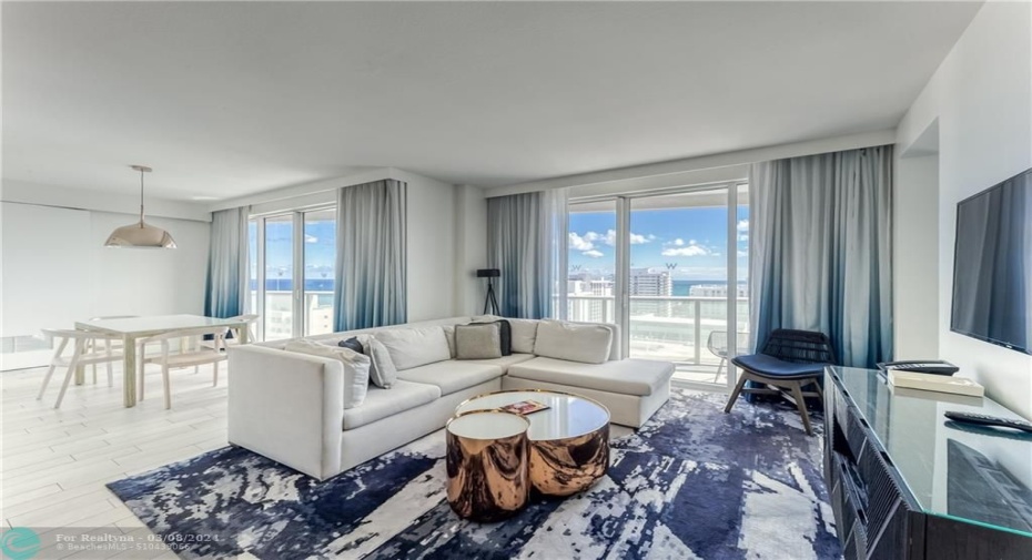 Oceanview Living Room with Queen Sleeper Sofa & Dining Area