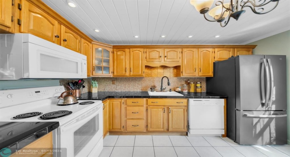 WOOD CABINETS WITH TILE BACKSPLASH
