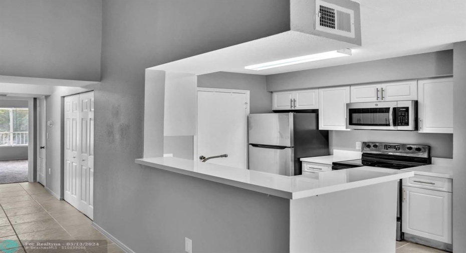View of Kitchen  and Bedroom entrances from Living Area