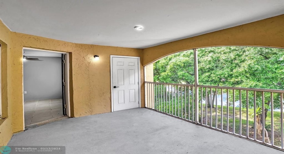 Screened Balcony with Storage Closet and entrance to Living Room