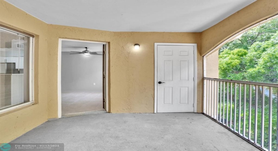 Screened Balcony with Storage Closet and entrance to Living Room