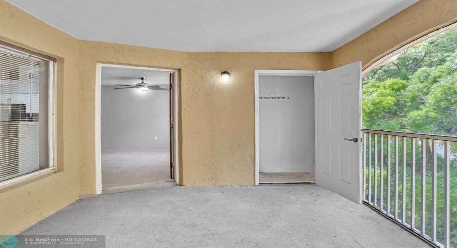 Screened Balcony with Storage Closet and entrance to Living Room