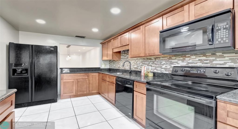 new high hat lighting, updated kitchen,fresh paint, all wood cabinetry and lots of storage