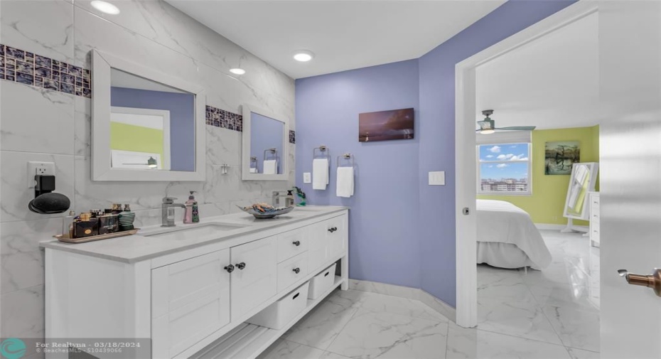 En suite bath with door opened to master suite