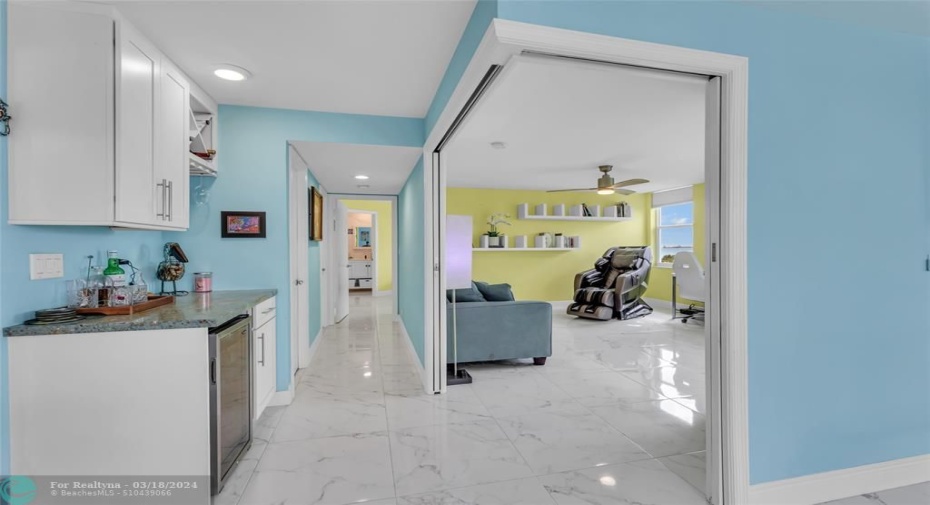 Long hallway to master suite. 2nd bedroom/office door open