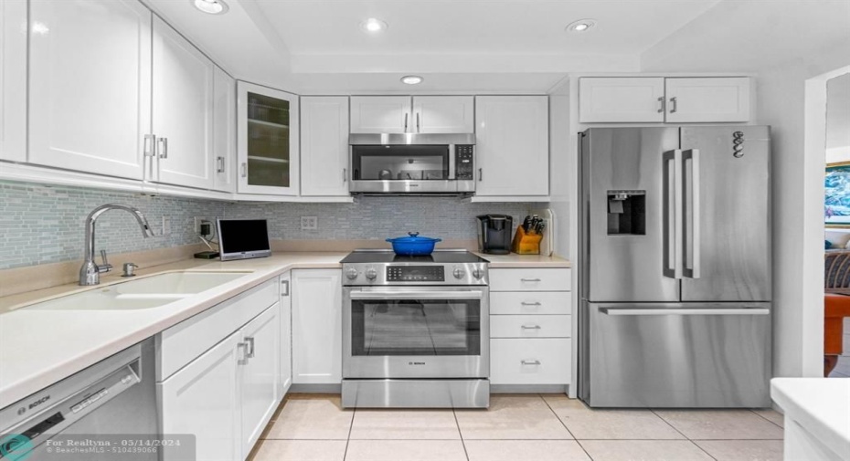Kitchen with updated appliances and generous counter space.