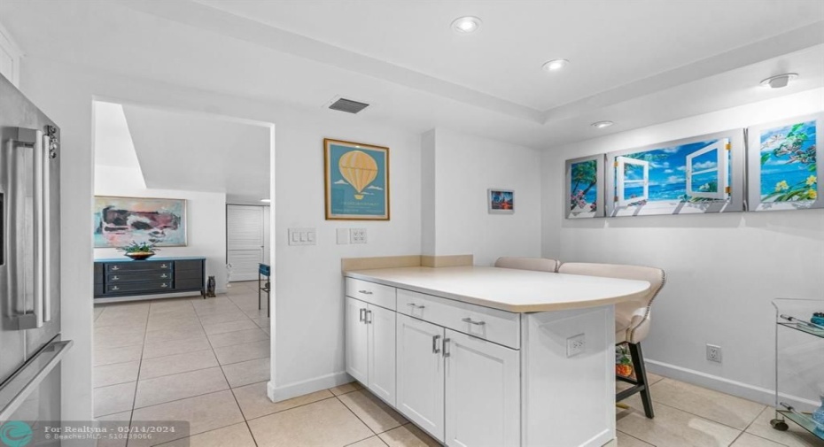 Counter breakfast area with bar stool seating.