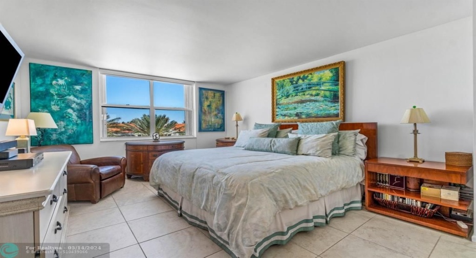 Primary bedroom with water views.