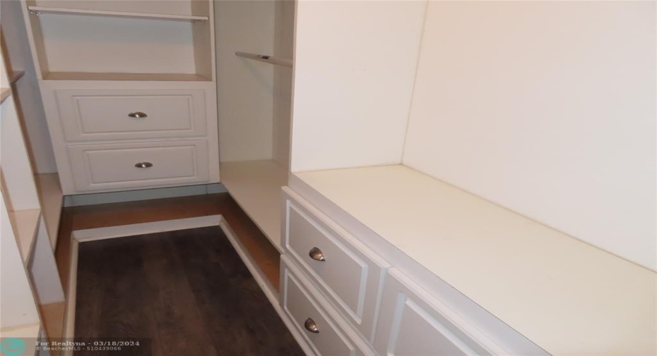 Organized master closet with drawers, etc.
