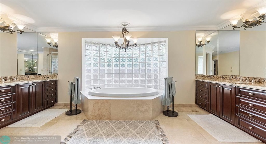 His and her sinks with Roman tub.