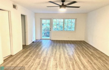 Living room and Dining room area with screened balcony