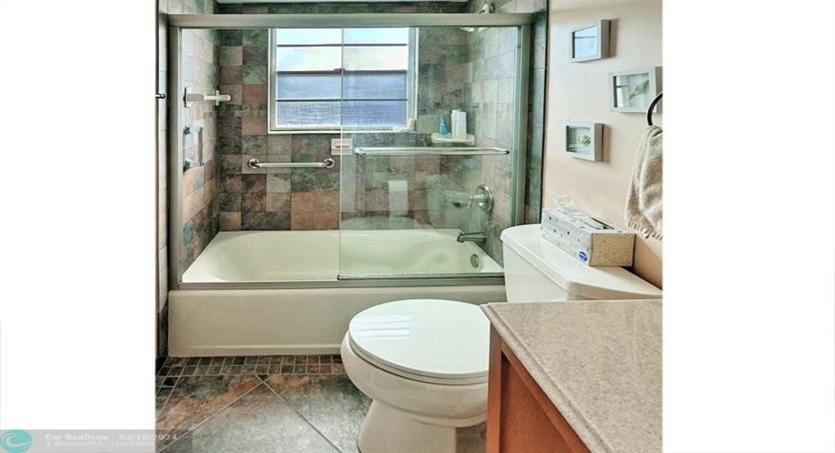 Tub/Shower Shows Mediterranean Style Tiles on Floor & Walls.