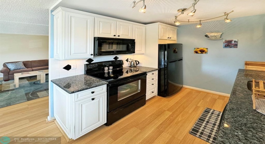 All Black Appliances w/White Wood Cabinets