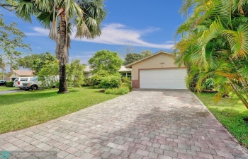 West facing front entrance to the home. Two car garage. Cul de sac to the left.