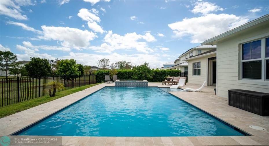 salt water heated pool with elevated spa