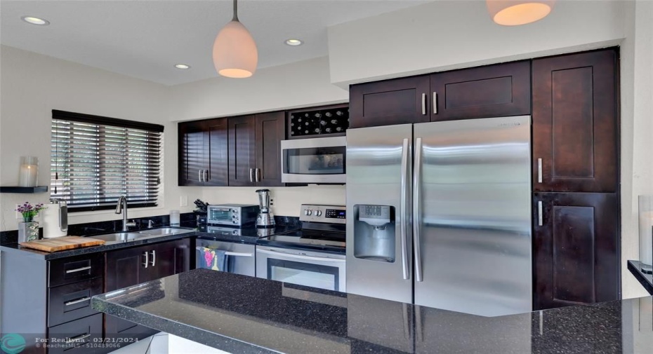 Kitchen with Wood Cabinetry & Stainless Appliances