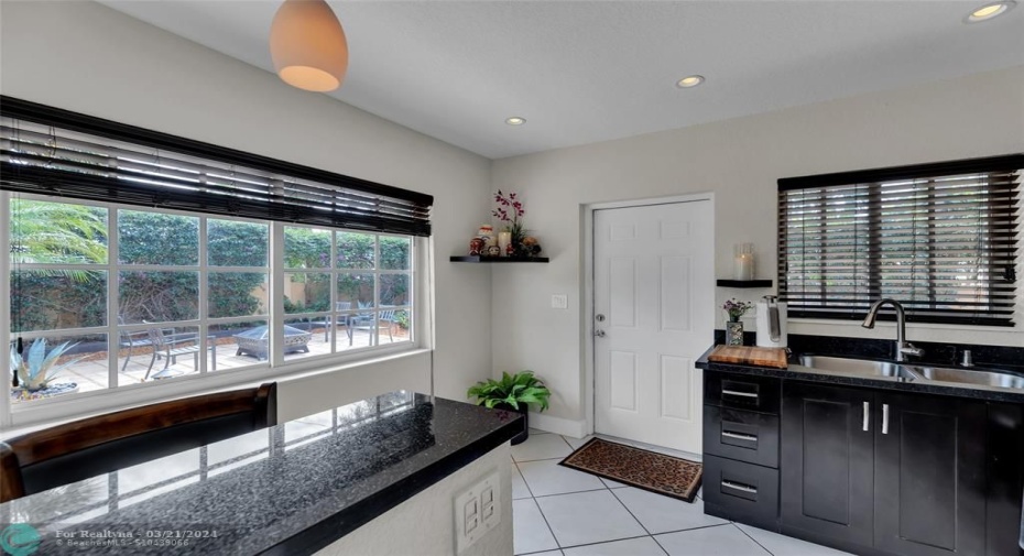 Backdoor off Kitchen to Patio & Gardens