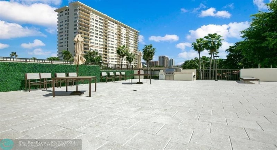 BBQ area by the pool and lounge area