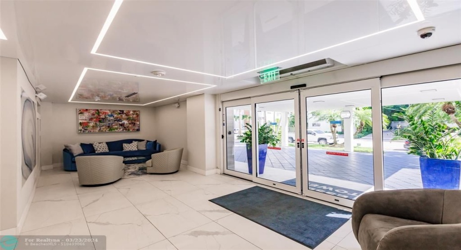 Covered entrance to 24 HR manned lobby