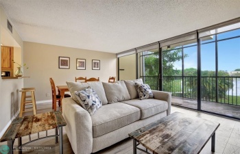 Enjoy an abundance of natural light from the floor-to-ceiling windows in this charming fully furnished 2nd level townhome offering 2 Master-Suites!