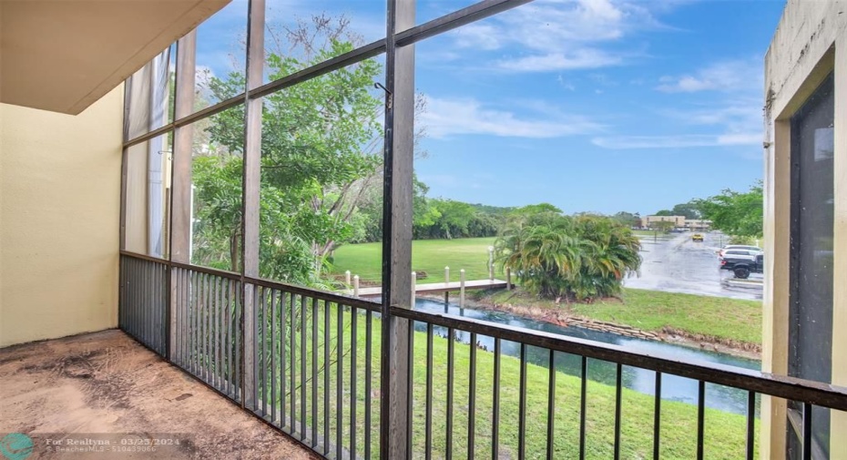 Downstairs Screened In Patio with water views.