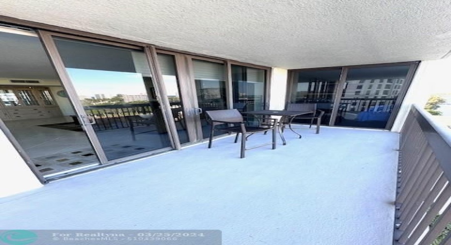 Large Private balcony with hurricane impact sliders from living room and master bedroom