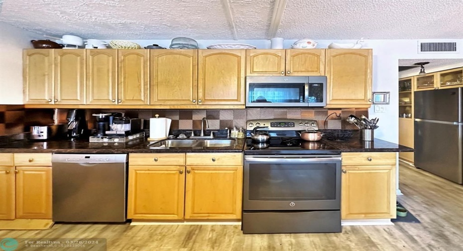 Galley Upper & Lower Storage w/Stainless Steel Appliances.