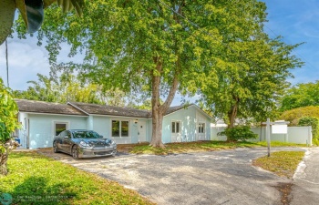 Spacious 4 bedroom, 2 bathroom home with circular driveway and large storage room on left side, where car is parked to convert to garage. Quiet dead end Street.