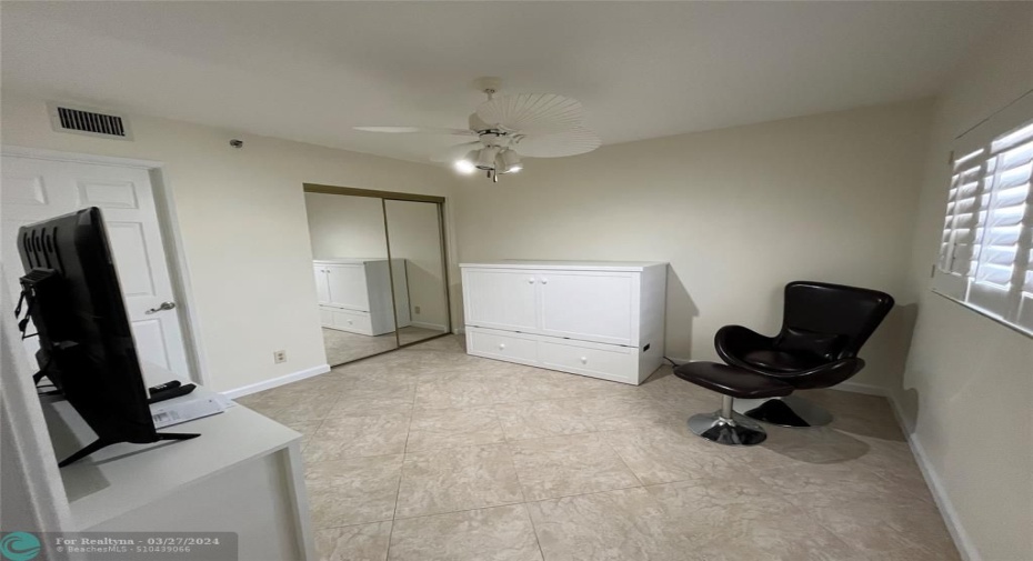 Queen Murphy bed folds away to leave lots of bedroom space.