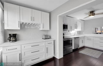 Rarely Available Corner Unit - Spacious 2 Bedroom 2 Bath Condo is Turn Key Move-In Ready. Located in one of the most desirable serene 55+ Communities of Margate. The unit features an Amazing View, Updated Custom Kitchen, Quartz Counters, Stainless Steel Appliances, Plantation Shutters, Impact Glass with lots of Natural Light, Screened Lanai with a view of gorgeous gardens & pool.