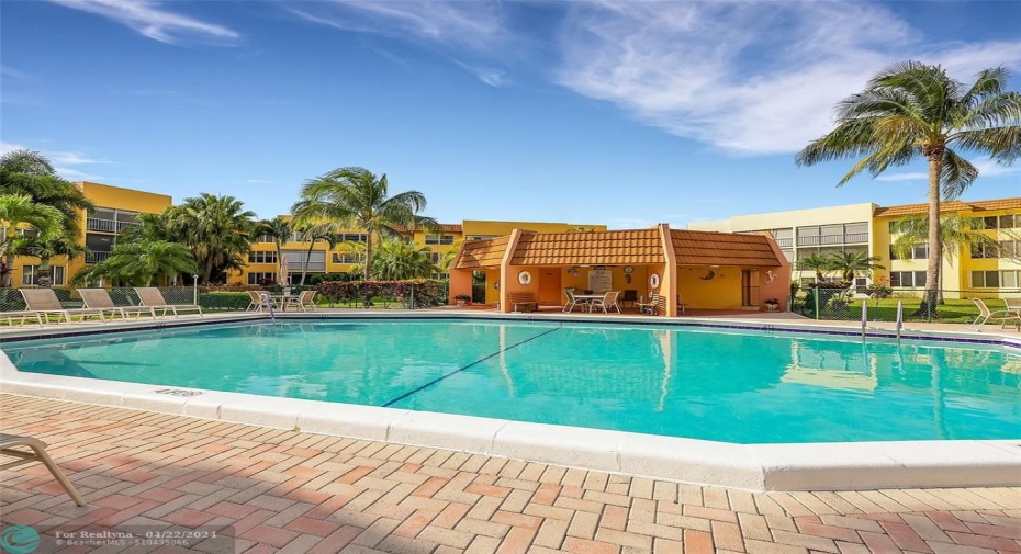 Rarely Available Corner Unit - Spacious 2 Bedroom 2 Bath Condo is Turn Key Move-In Ready. Located in one of the most desirable serene 55+ Communities of Margate. The unit features an Amazing View, Updated Custom Kitchen, Quartz Counters, Stainless Steel Appliances, Plantation Shutters, Impact Glass with lots of Natural Light, Screened Lanai with a view of gorgeous gardens & pool.