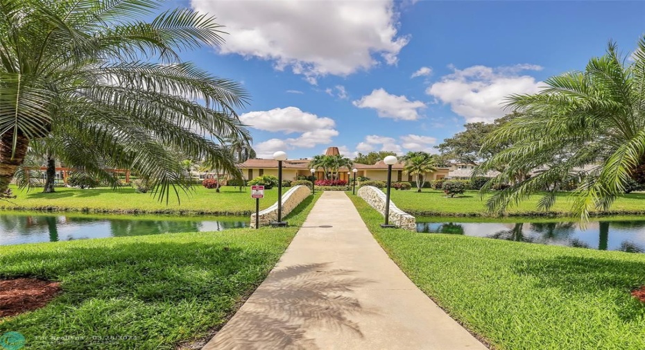 Lush landscaping taking you to the Clubhouse