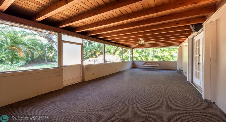 screened and window from kitchen to patio and backyard view