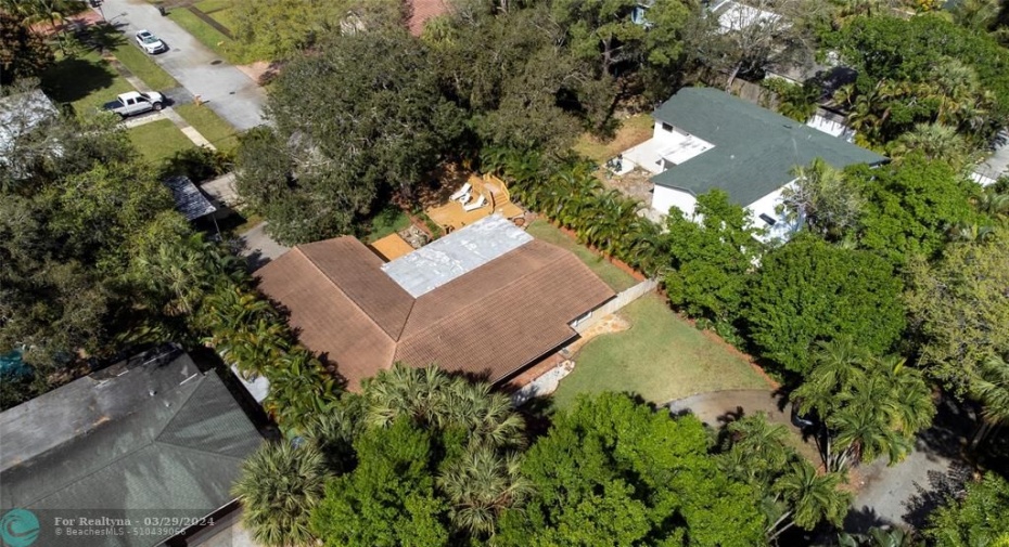circular drive in front off private road , public road in back brings you right into private gated entryway, shed, carport and garage, access to wood decked patio as well. Large Side Gated Yard as well.