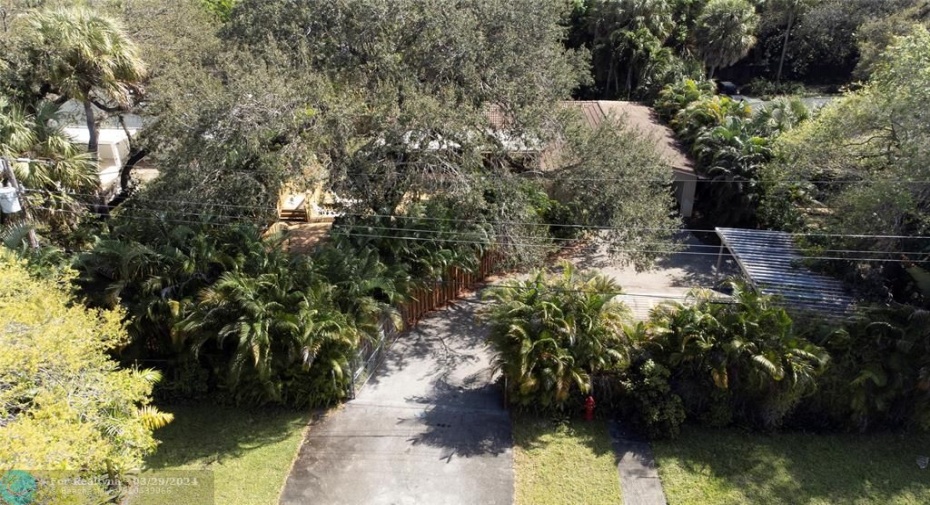 Large Shed and Carport in addition to 2 car garage and more. Yard completely fenced.