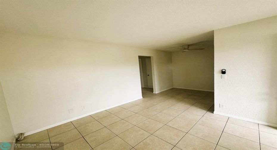 Living Room with a shot of the Dining Room