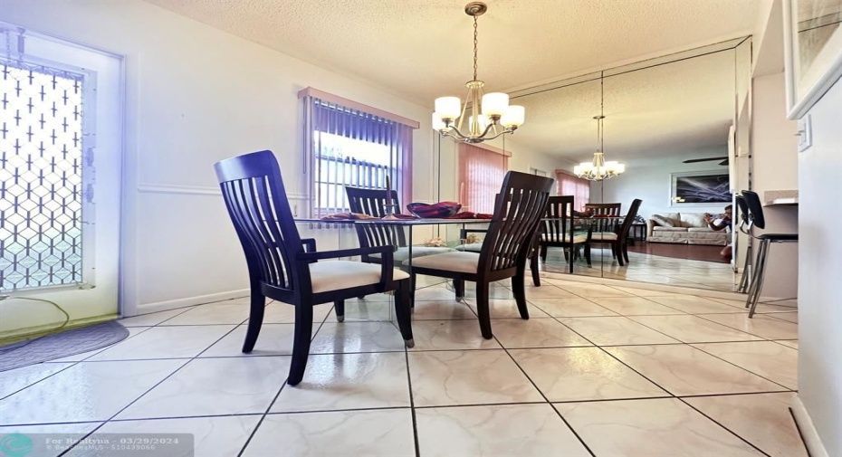 Mirrored Wall in Dining Area Adds Dimension