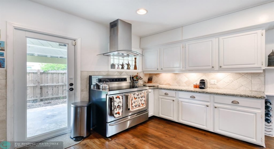 Kitchen with door to carport