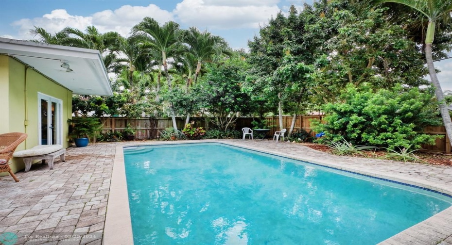 Pool with french door to the primary bedroom