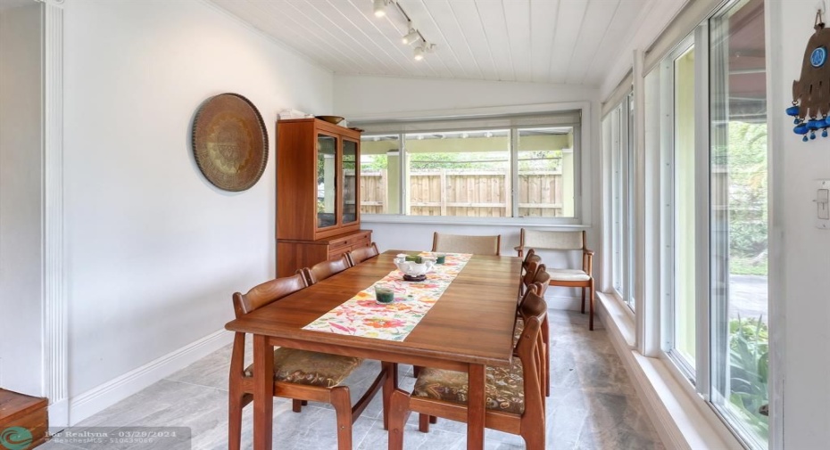 View of entrance/dining room which large windows