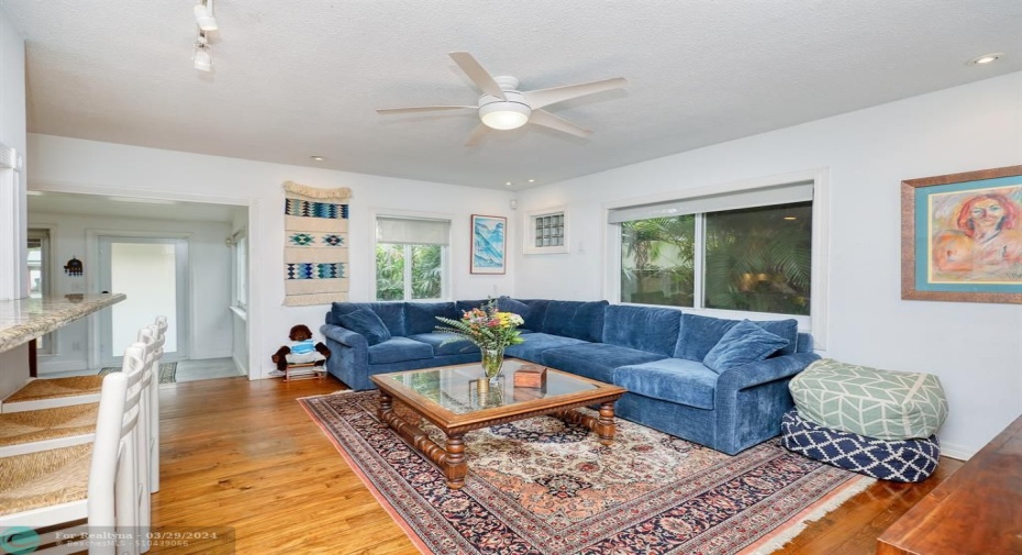 View looking toward front door through the living room and dining room