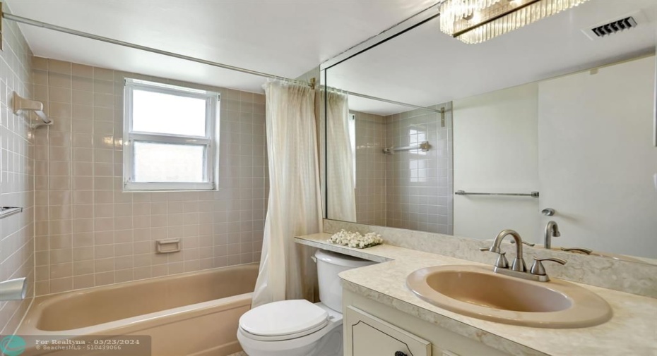 GUEST BATH LIGHT TAN TILE IMPACT WINDOW