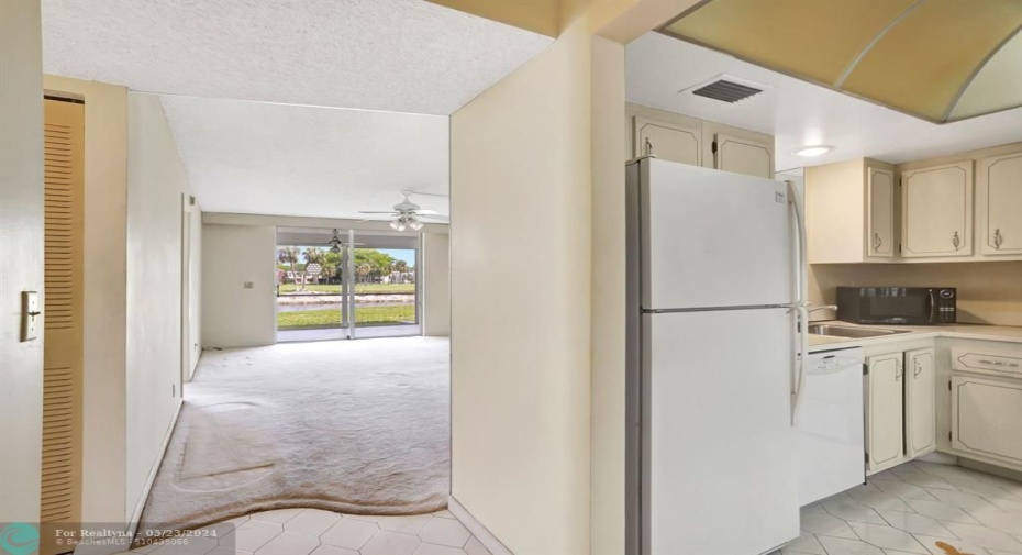 KITCHEN AND VIEW TO LIVING ROOM