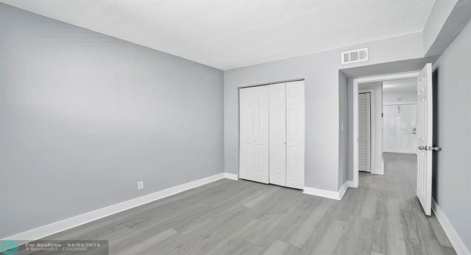 bedroom 2, double closet, new floors, fresh paint