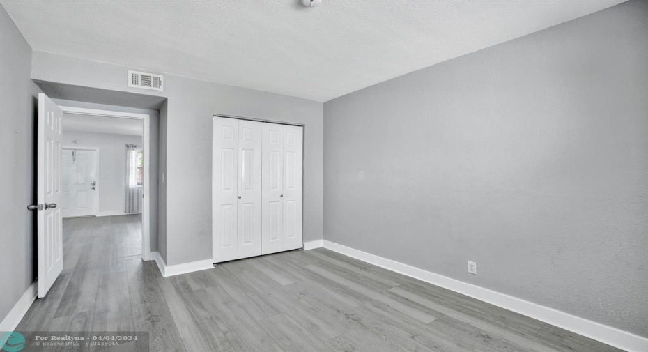 bedroom 1, double closet, new floors, fresh paint